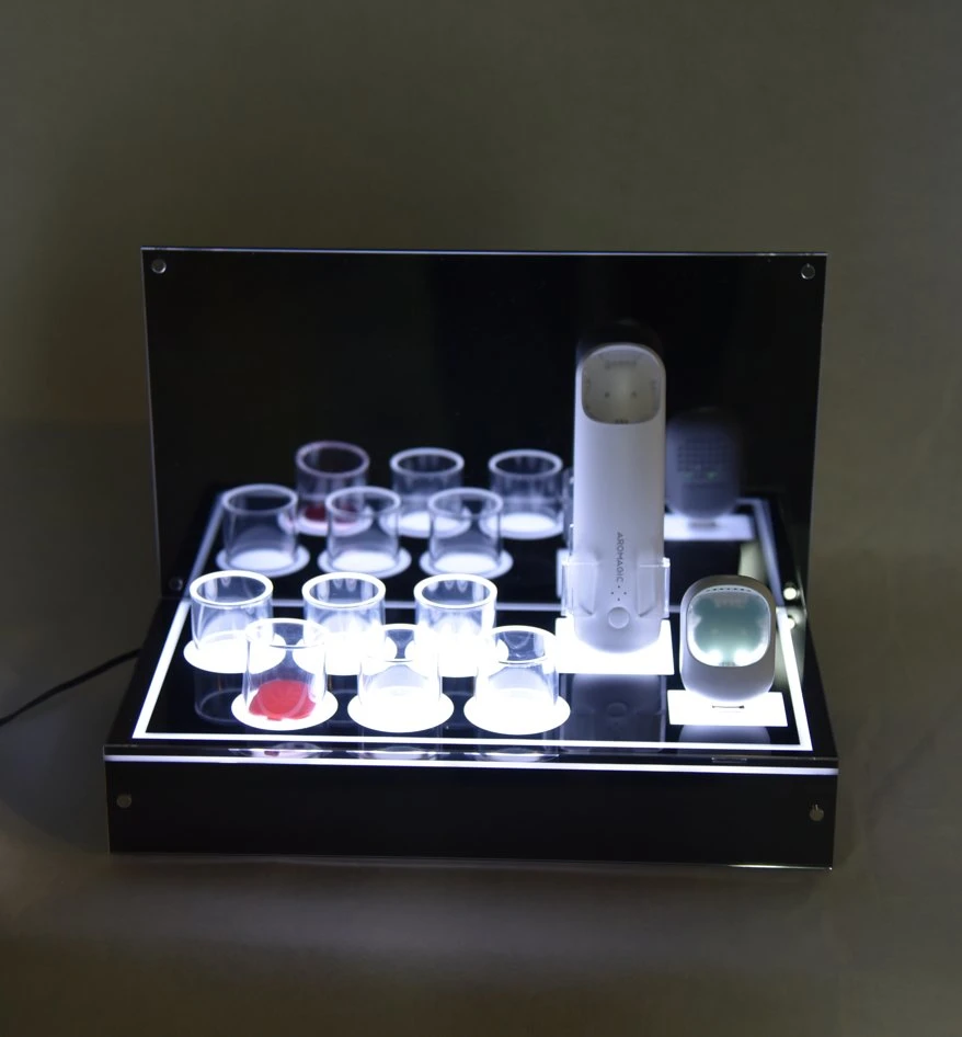 Unique Design Counter Table Acrylic with LED Light Cosmetic Perfume Display Stand