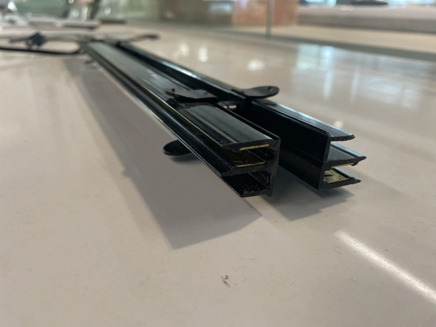 Black LED Power Track with No Exposed Rails for Shelf Lighting