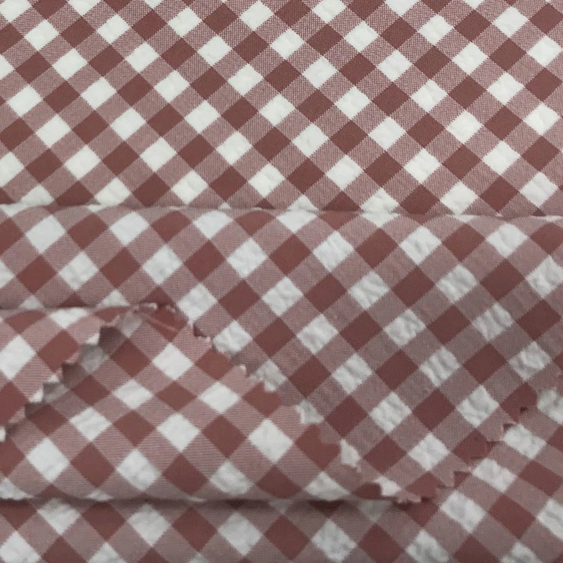 Made in China New Cationic Polyester Elastic Bubble Wrinkle Laid Stripe Fabric Ladies Casual Wear Fabric Spot Wholesale/Supplier