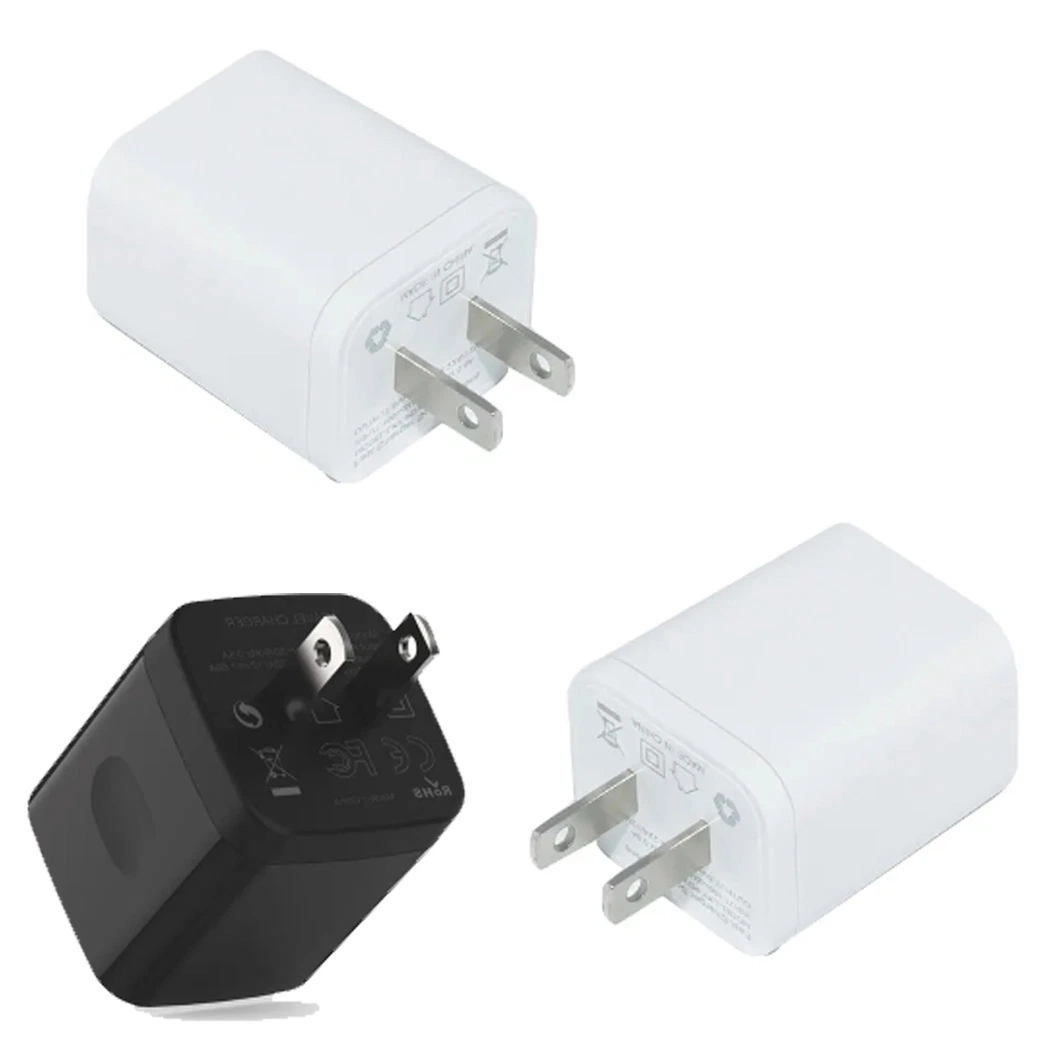 Adaptateur secteur de voyage avec double prise USB pour charger deux appareils simultanément.