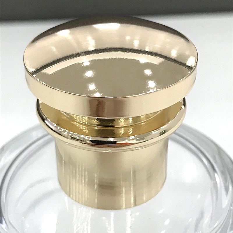 Tampa de Metal Zamak para Frasco de Perfume de Luxo com Acabamento Dourado Polido.