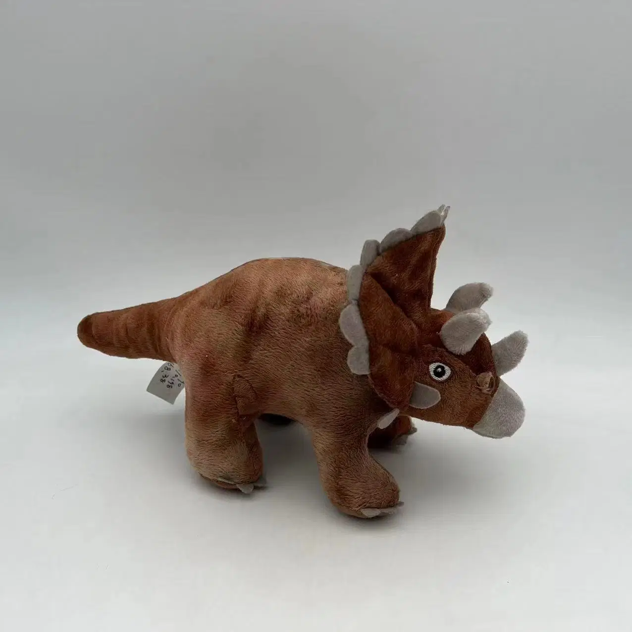 Jouet en peluche debout en gros de simulation réaliste de dinosaure en peluche pour animaux de compagnie.