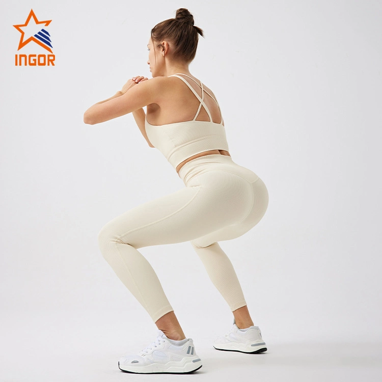 Los fabricantes de ropa de gimnasia deportiva Ingor mujeres Activewear personalizada Deportes Bras y pantalones de yoga Leggings establece desgaste con sostenible reciclado