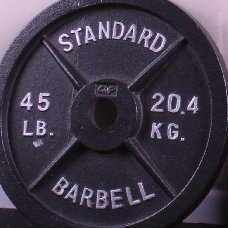 Plaques de poids en fonte pour haltère de fitness à domicile, idéales pour la musculation en salle de sport.