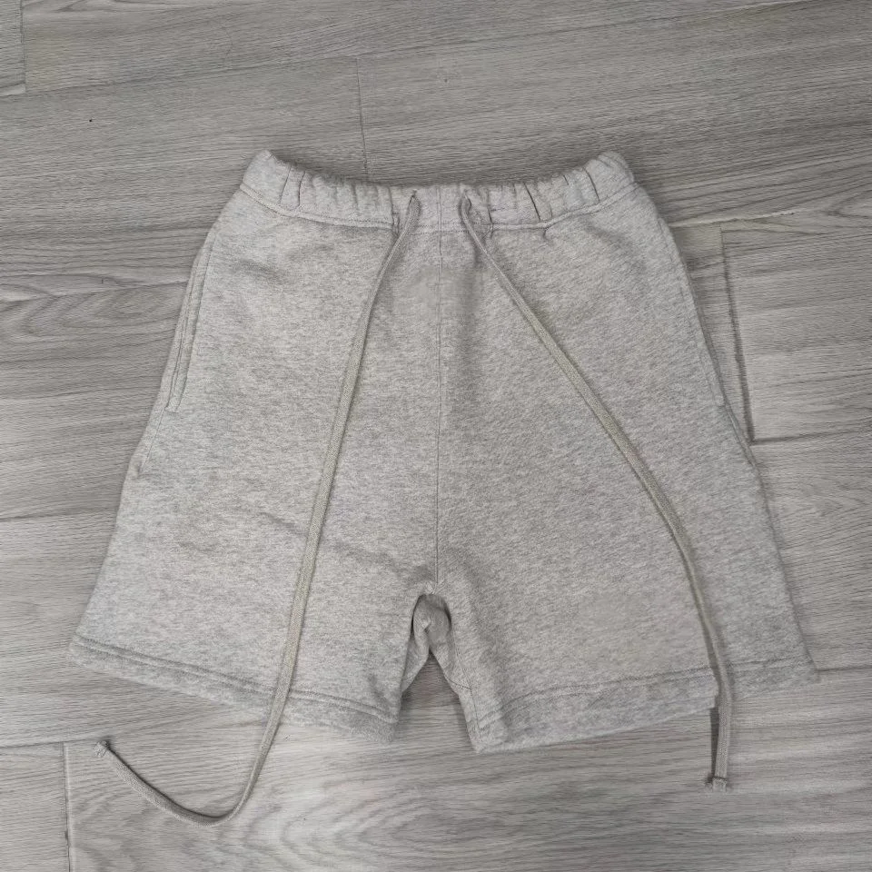 Shorts en coton éponge uni de haute qualité avec logo personnalisé en gros pour hommes et femmes.