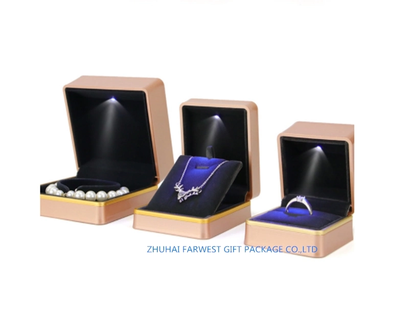 Caja de regalo de plástico de gama alta de color dorado con LED Luz interior Negro Velvet espuma de almacenamiento de almacenamiento de envases al por mayor Zhuhai OEM buena calidad Precio bajo