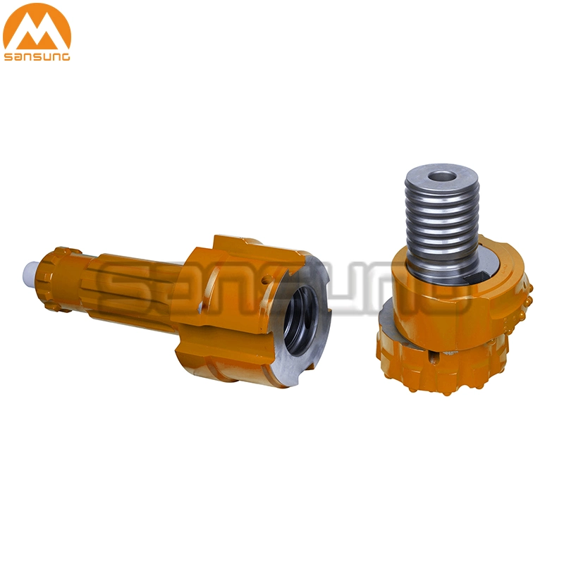 Overburden Casing System Rock Drilling Tools with Pilot Bit, Reamer and Guide Device