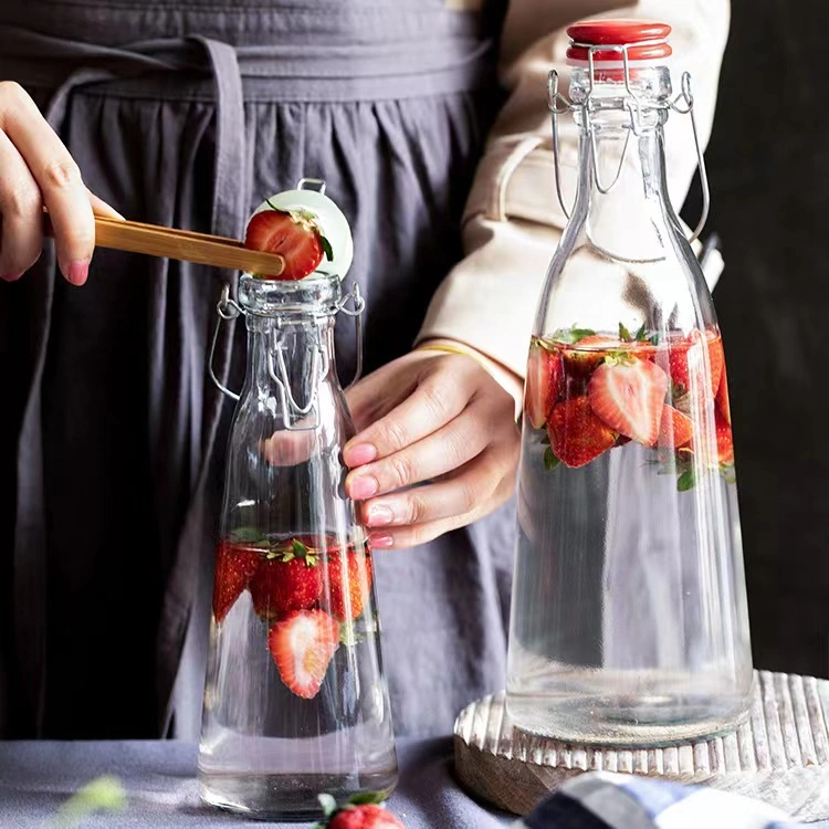 Comercio al por mayor tamaño grande transparente 500ml de zumo de 1000ml frasco de cristal para beber del vaso de leche con tapa basculante Broche de cerámica